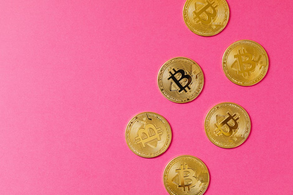Gold Bitcoin coins on a vibrant pink surface, representing cryptocurrency and blockchain investment